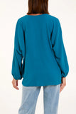 As Seen in Unique’s Video: V Neck Front Tie Blouse in Teal