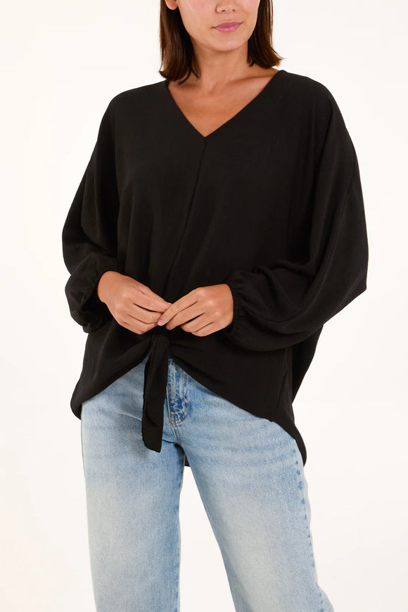 As Seen in Unique’s  Video: V Neck Tie Front Blouse in Black