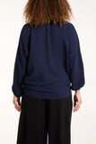 As seen in Unique’s Video: V Neck Front Tie Navy Blouse